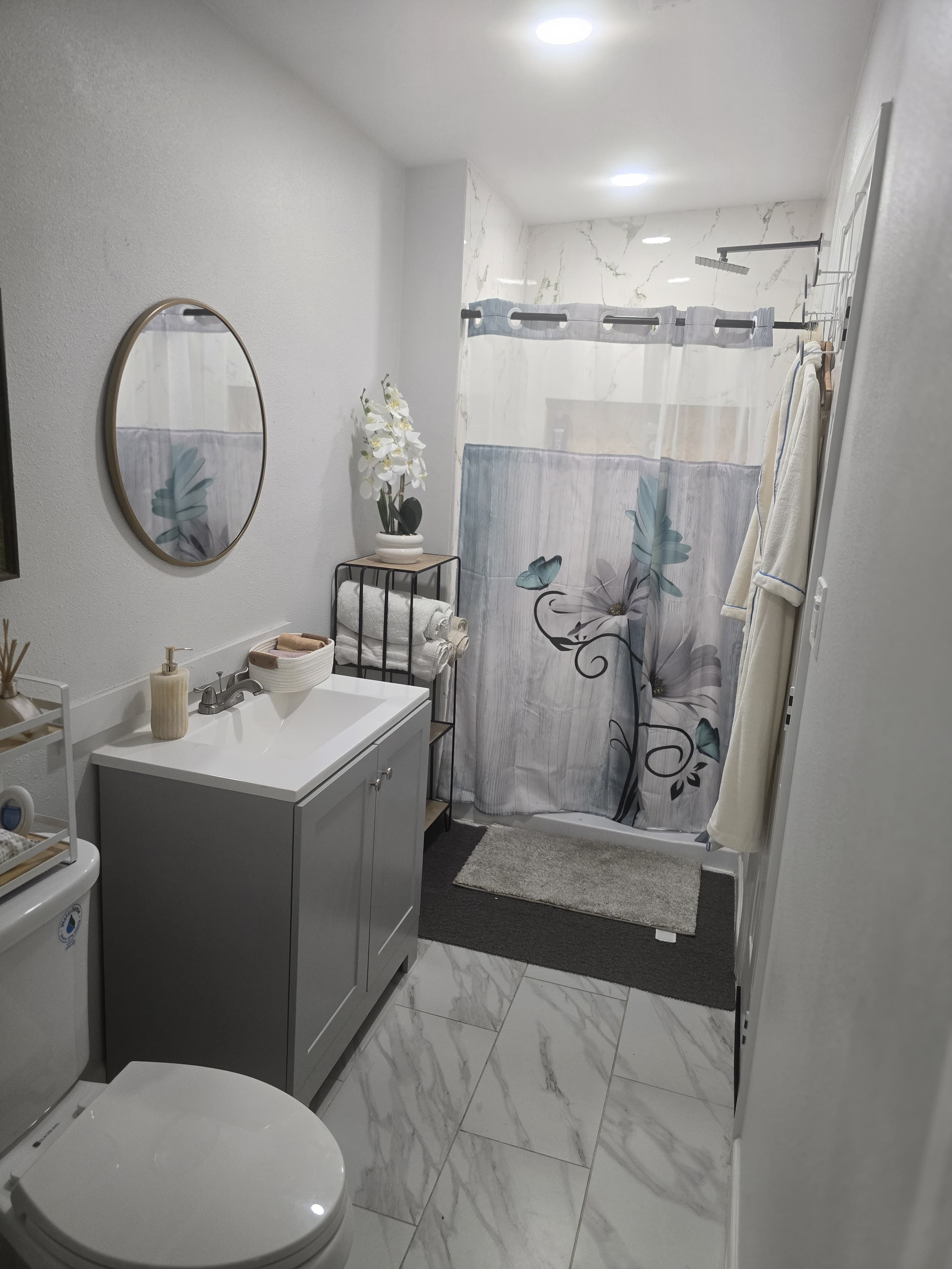 Full spa bathroom with shower and robe